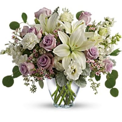 <div id="mark-2" class="m-pdp-tabs-marketing-description">Luxe in love! Pale lavender roses, creamy white lilies and delicate greens create a soft sweet bouquet that's as tender as your feelings.</div>
<div id="desc-2">
<ul>
<li>Lavender roses, white asiatic lilies, white lisianthus, white stock, lavender waxflower, and white sinuata statice are accented with dusty miller, seeded eucalyptus, and silver dollar eucalyptus.</li>
<li>Delivered in a serenity vase.</li>
</ul>
</div>